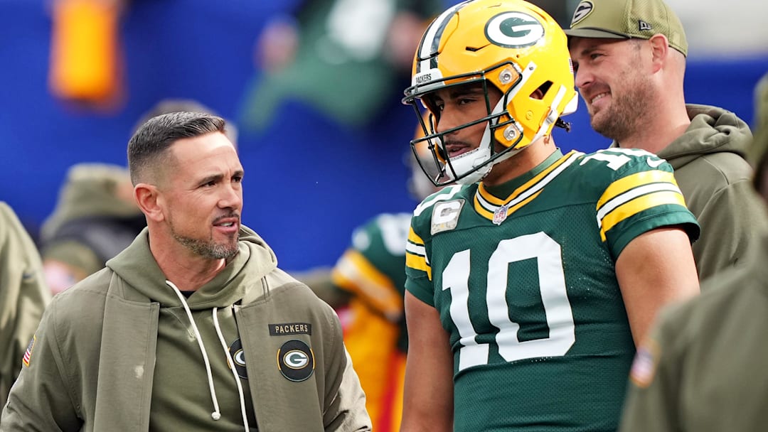 Nov 16, 2025; East Rutherford, New Jersey, USA; Green Bay Packers head coach Matt LaFleur talks with quarterback Jordan Love (10) before the game against the New York Giants at MetLife Stadium.