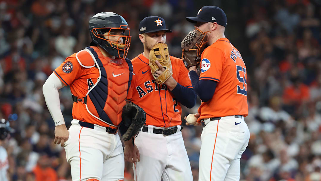 Oct 2, 2024; Houston, Texas, USA; Houston Astros pitcher Ryan Pressly (55) talks with catcher Yainer Diaz (21) and third base Alex Bregman (2) during the eighth inning of game two of the Wildcard round for the 2024 MLB Playoffs against the Detroit Tigers at Minute Maid Park. Mandatory Credit: Thomas Shea-Imagn Images