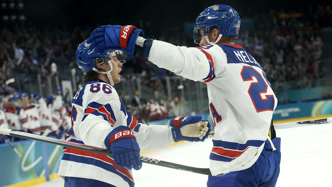 Feb 12, 2026; Milan, Italy; Brock Nelson of United States celebrates scoring their fourth goal with Jack Hughes of United States against Latvia in men's ice hockey group C play during the Milano Cortina 2026 Olympic Winter Games at Milano Santagiulia Ice Hockey Arena. Mandatory Credit: Geoff Burke-Imagn Images