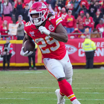 Dec 21, 2024; Kansas City, Missouri, USA; Kansas City Chiefs running back Kareem Hunt (29) runs the ball against the Houston Texans during the second half at GEHA Field at Arrowhead Stadium. Mandatory Credit: Denny Medley-Imagn Images