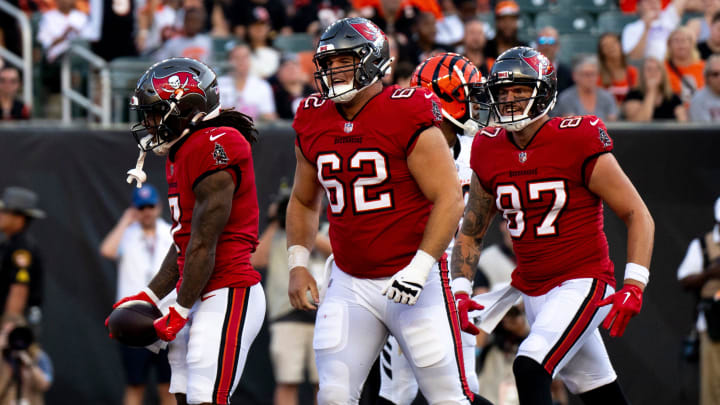 Tampa Bay Buccaneers running back Bucky Irving (7) and Tampa Bay Buccaneers center Graham Barton (62) react after he scored a touchdown in the second quarter of the NFL preseason game against the Cincinnati Bengals at Paycor Stadium in Cincinnati on Saturday, August 10, 2024.