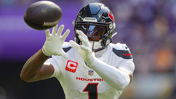 Sep 22, 2024; Minneapolis, Minnesota, USA; Houston Texans wide receiver Stefon Diggs (1) warms up before the game against the Minnesota Vikings at U.S. Bank Stadium. Mandatory Credit: Brad Rempel-Imagn Images