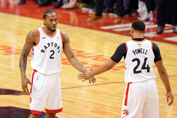 Toronto Raptors Forward Kawhi Leonard (2) High Fives Forward Norman Powell (24)