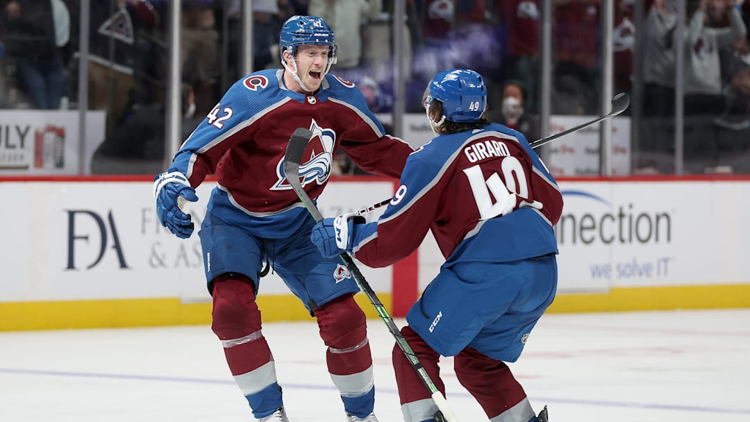 Colorado Avalanche defensemen Josh Manson (42) and Samuel Girard (49)