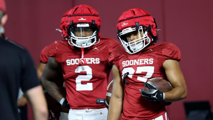 Oklahoma's Jovantae Barnes, left, and Gavin Sawchuk