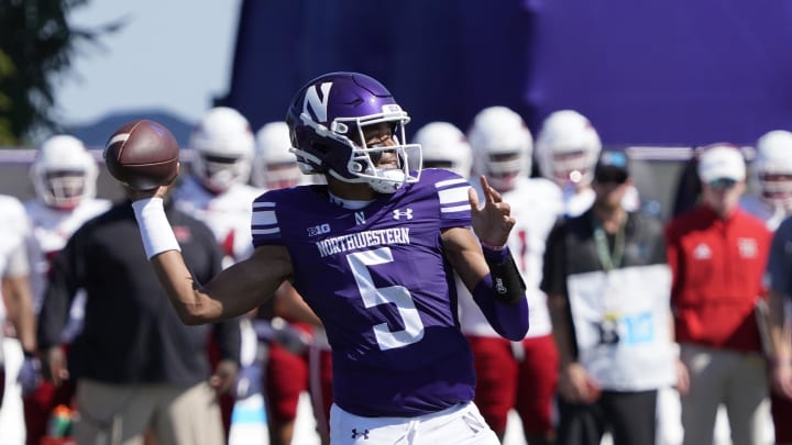 Aug 31, 2024; Evanston, Illinois, USA; Northwestern Wildcats quarterback Mike Wright (5) looks to throw a pass against the Miami (Oh) Redhawks during the first half at Lanny and Sharon Martin Stadium. Mandatory Credit: David Banks-USA TODAY Sports