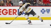 Nov 23, 2024; Detroit, Michigan, USA; Boston Bruins center Tyler Johnson (90) shoots the puck during the first period of the game against the Detroit Red Wings at Little Caesars Arena. Mandatory Credit: Brian Bradshaw Sevald-Imagn Images