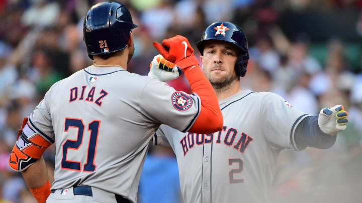 Aug 10, 2024; Boston, Massachusetts, USA;  Houston Astros designated hitter Yainer Diaz (21) reacts with third baseman Alex Bregman (2) after Bregman hit a home run during the seventh inning against the Boston Red Sox at Fenway Park.