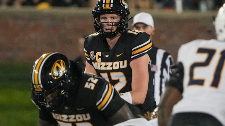 Aug 29, 2024; Columbia, Missouri, USA; Missouri Tigers quarterback Brady Cook (12) readies for the snap against the Murray State Racers during the first half at Faurot Field at Memorial Stadium. Mandatory Credit: Denny Medley-USA TODAY Sports