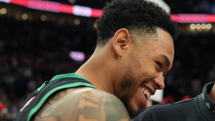 Dec 28, 2025; Portland, Oregon, USA; Boston Celtics guard Anfernee Simons (4) and Portland Trail Blazers guard Damian Lillard (0) meet after the game at Moda Center. Mandatory Credit: Soobum Im-Imagn Images