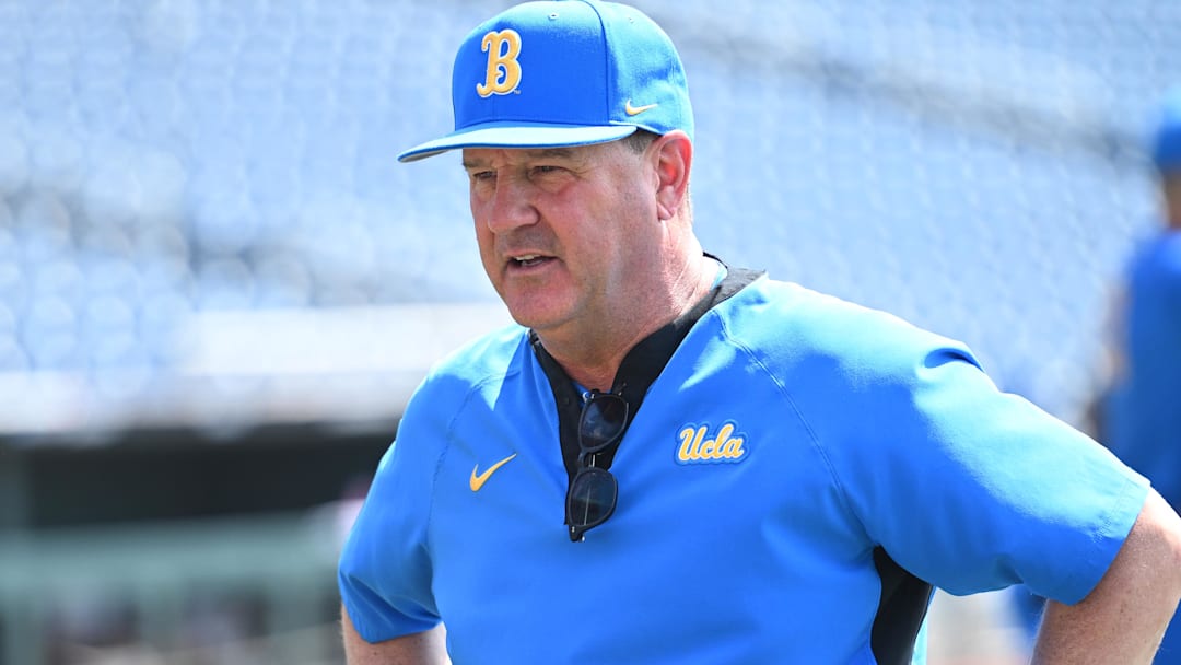 Jun 14, 2025; Omaha, Neb, USA;  UCLA Bruins head coach John Savage on the field before the game against the Murray State Races at Charles Schwab Field. Mandatory Credit: Steven Branscombe-Imagn Images