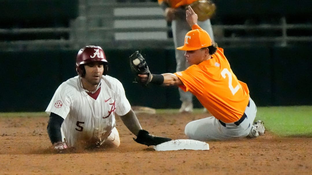 Mar 21, 2025; Tuscaloosa AL, USA; Alabama outfielder Richie Bonomolo Jr. (5) slides into second with a stolen base as Tennessee infielder Ariel Antigua applies a late tag during the second game of the series at Sewell-Thomas Stadium.