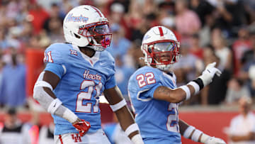 Oct 4, 2025; Houston, Texas, USA; Houston Cougars defensive back Zelmar Vedder (21) reacts to his defensive play against the Texas Tech Raiders in the first half at TDECU Stadium. Mandatory Credit: Thomas Shea-Imagn Images
