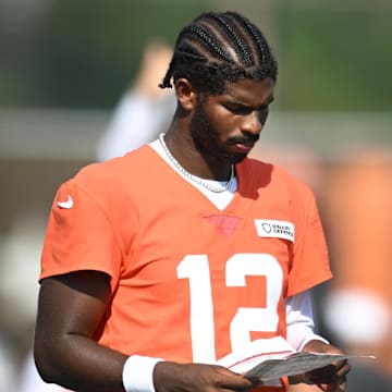 Jul 26, 2025; Berea, OH, USA; Cleveland Browns quarterback Shedeur Sanders (12) looks at a play sheet during training camp at CrossCountry Mortgage Campus. Mandatory Credit: Ken Blaze-Imagn Images