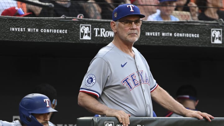 Jun 29, 2024; Baltimore, Maryland, USA;  Texas Rangers manager Bruce Bochy (15) looks onto the field during the first inning against the Baltimore Orioles at Oriole Park at Camden Yards. Mandatory Credit: Tommy Gilligan-USA TODAY Sports