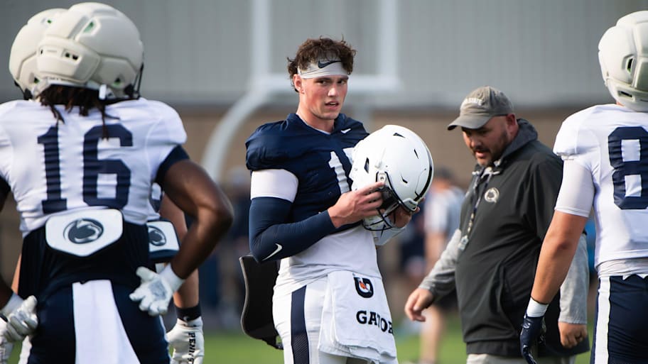 Penn State quarterback Drew Allar puts his helmet on during a practice session outside Holuba Hall.