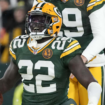 Nov 28, 2024; Green Bay, Wisconsin, USA;  Green Bay Packers cornerback Robert Rochell (22) celebrates with punter Daniel Whelan (19) after recovering a fumbel during the first quarter against the Miami Dolphins at Lambeau Field. Mandatory Credit: Jeff Hanisch-Imagn Images