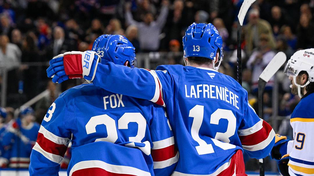 Apr 8, 2026; New York, New York, USA; New York Rangers defenseman Adam Fox (23) celebrates his goal with New York Rangers left wing Alexis Lafrenière (13) against the Buffalo Sabres during the second period at Madison Square Garden. Mandatory Credit: Dennis Schneidler-Imagn Images