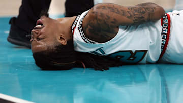 Apr 24, 2025; Memphis, Tennessee, USA; Memphis Grizzlies guard Ja Morant (12) lays on the court after being fouled during the second quarter against the Oklahoma City Thunder during game three for the first round of the 2024 NBA Playoffs at FedExForum. Mandatory Credit: Petre Thomas-Imagn Images