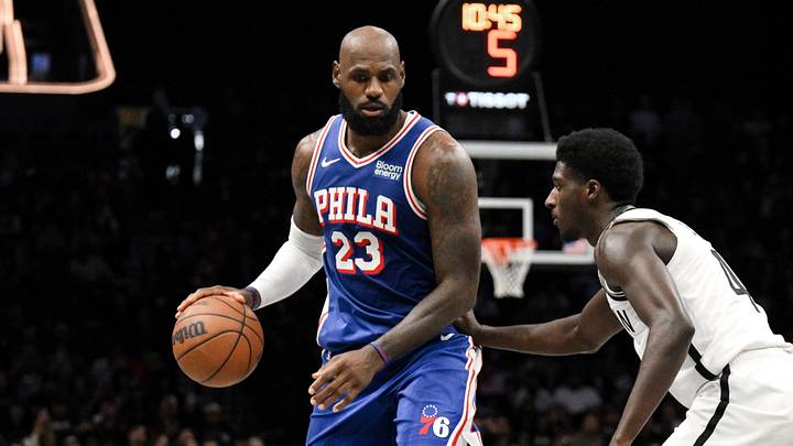 Oct 8, 2026; Brooklyn, New York, USA;  Philadelphia 76ers forward Lebron James (23) sets the play while defended by Brooklyn Nets guard Drake Powell (4) during the first half at Barclays Center.  