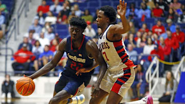 South Alabama Jaguars forward Barry Dunning Jr. (22) drives to the basket as Mississippi Rebels guard Davon Barnes (7) defends during the second half at C.M. 'Tad' Smith Coliseum. 