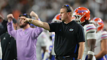 Sep 20, 2025; Miami Gardens, Florida, USA; Florida Gators head coach Billy Napier signals against the Miami Hurricanes during the second quarter at Hard Rock Stadium. Mandatory Credit: Sam Navarro-Imagn Images