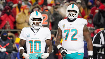 Jan 13, 2024; Kansas City, Missouri, USA; Miami Dolphins wide receiver Tyreek Hill (10) and offensive tackle Terron Armstead (72) on field against the Kansas City Chiefs in a 2024 AFC wild card game at GEHA Field at Arrowhead Stadium. Mandatory Credit: Denny Medley-Imagn Images