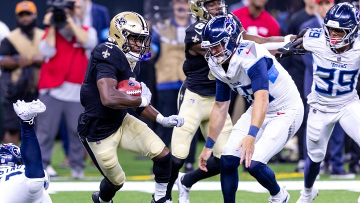 Aug 25, 2024; New Orleans, Louisiana, USA;  New Orleans Saints running back Jacob Kibodi (35) rushes against Tennessee Titans linebacker Chance Campbell (45) during the second half at Caesars Superdome. Mandatory Credit: Stephen Lew-USA TODAY Sports