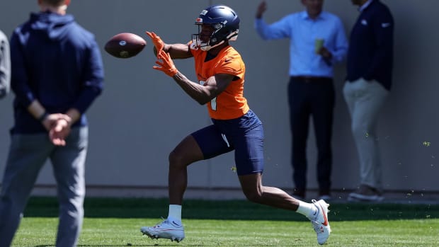 Denver Broncos wide receiver Marvin Mims Jr. catches a pass during organized team activities.