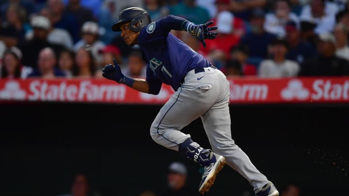 Seattle Mariners second baseman Jorge Polanco hits a single against the Los Angeles Angels on Thursday at Angel Stadium in Anaheim, Calif.