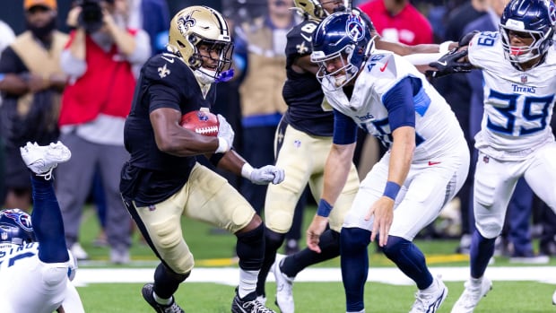 New Orleans Saints running back Jacob Kibodi (35) rushes past Tennessee Titans linebacker Chance Campbell 