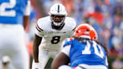 Mississippi State Bulldogs linebacker Malick Sylla (8) stares at Florida Gators quarterback DJ Lagway (2) before the snap during the first half at Ben Hill Griffin Stadium.