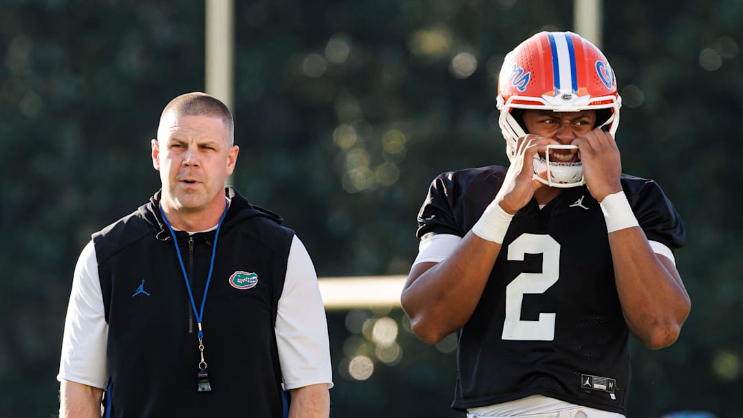 Florida Gators head coach Billy Napier and Florida Gators quarterback DJ Lagway (2) watch during spring football practice at Heavener Football Complex at the University of Florida in Gainesville, FL on Thursday, March 6, 2025. [Matt Pendleton/Gainesville Sun]