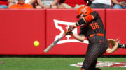 Oklahoma State's Caroline Wang (66) hits a single in the sixth inning during the Bedlam college