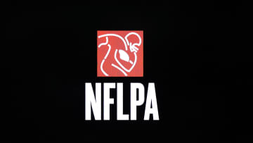 Feb 1, 2018; Bloomington, MN, USA; A detailed view of NFLPA  logo during a press conference in advance of Super Bowl LII between the New England Patriots and Philadelphia Eagles at Mall of America. Mandatory Credit: Matthew Emmons-USA TODAY Sports