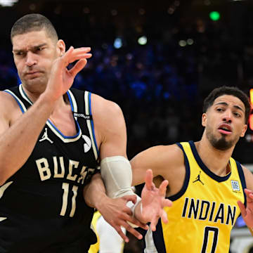 Apr 27, 2025; Milwaukee, Wisconsin, USA; Milwaukee Bucks center Brook Lopez (11) looks for a rebound against Indiana Pacers guard Tyrese Haliburton (0) in the first quarter during game four of first round for the 2024 NBA Playoffs at Fiserv Forum. Mandatory Credit: Benny Sieu-Imagn Images
