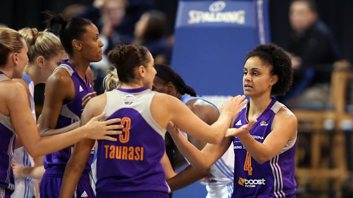 Sep 12, 2014; Chicago, IL, USA; Phoenix Mercury forward Candice Dupree (4) celebrates with teammates including guard Diana Taurasi (3) after scoring a basket against the Chicago Sky during the second half in game three of the 2014 WNBA Finals at UIC Pavilion. Mandatory Credit: Jerry Lai-Imagn Images