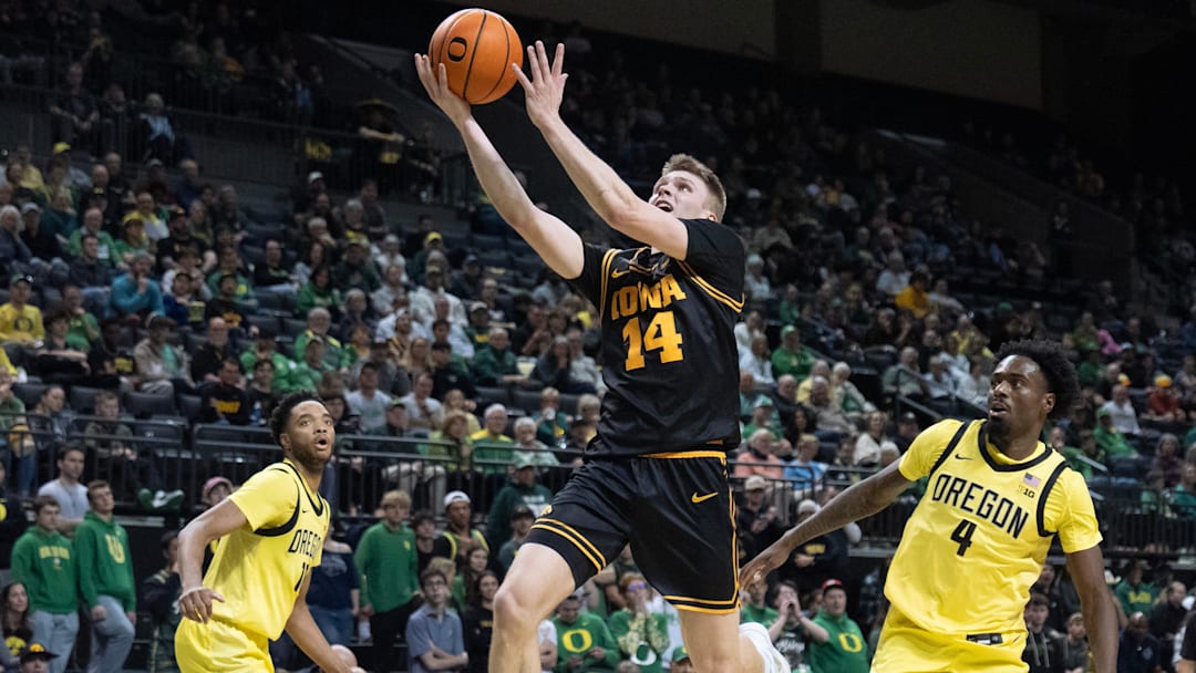 Iowa’s Bennett Stirtz, center, goes up for a shot against Oregon during the first half at Matthew Knight Arena in Eugene Feb 1, 2026. Iowa’s Bennett Stirtz, center, goes up for a shot against Oregon during the first half at Matthew Knight Arena in Eugene Feb 1, 2026.