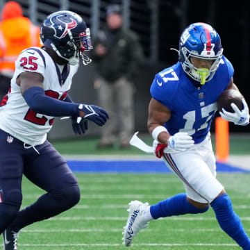 Nov 13, 2022; East Rutherford, NJ, USA;  New York Giants wide receiver Wan'Dale Robinson (17) runs for a first down as Houston Texans defensive back Desmond King II defends during the first quarter at MetLife Stadium.  
