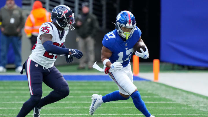 Nov 13, 2022; East Rutherford, NJ, USA;  New York Giants wide receiver Wan'Dale Robinson (17) runs for a first down as Houston Texans defensive back Desmond King II defends during the first quarter at MetLife Stadium.  