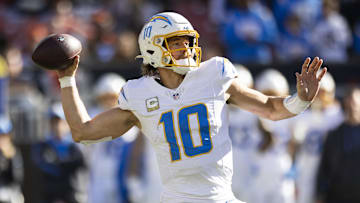 Nov 3, 2024; Cleveland, Ohio, USA; Los Angeles Chargers quarterback Justin Herbert (10) throws the ball against the Cleveland Browns during the second quarter at Huntington Bank Field. Mandatory Credit: Scott Galvin-Imagn Images