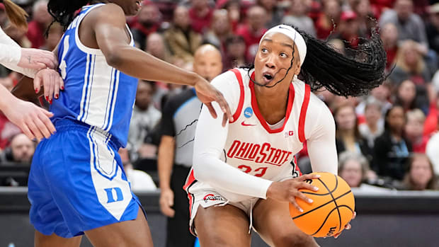 Ohio State Buckeyes forward Cotie McMahon maneuvers around Duke Blue Devils guard Jadyn Donovan.