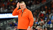 Mar 21, 2025; Milwaukee, WI, USA: Illinois Fighting Illini head coach Brad Underwood watches play down court during the first half against the Xavier Musketeers at Fiserv Forum. Mandatory Credit: Benny Sieu-Imagn Images