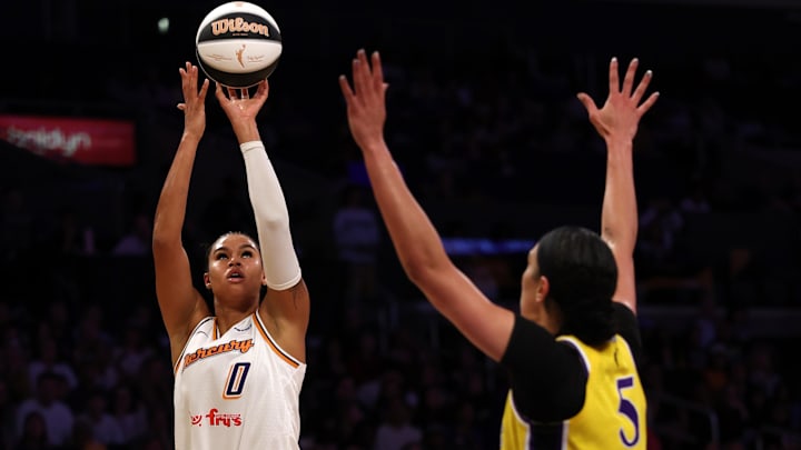 Jun 1, 2025; Los Angeles, California, USA;  Phoenix Mercury forward Satou Sabally (0) shoots the ball over Los Angeles Sparks forward Dearica Hamby (5) during the first quarter at Crypto.com Arena. Mandatory Credit: Kiyoshi Mio-Imagn Images