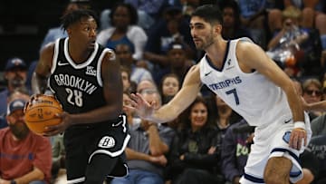 Oct 30, 2024; Memphis, Tennessee, USA; Brooklyn Nets forward Dorian Finney-Smith (28) handles the ball as Memphis Grizzlies forward Santi Aldama (7) defends during the second half at FedExForum. Mandatory Credit: Petre Thomas-Imagn Images
