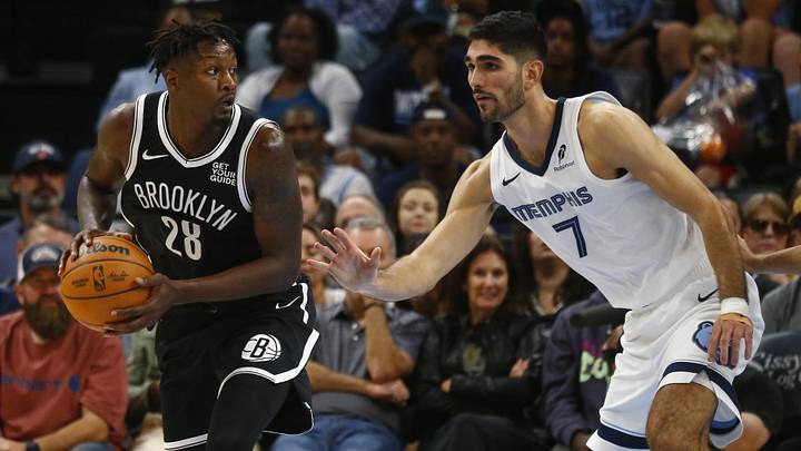 Oct 30, 2024; Memphis, Tennessee, USA; Brooklyn Nets forward Dorian Finney-Smith (28) handles the ball as Memphis Grizzlies forward Santi Aldama (7) defends during the second half at FedExForum. Mandatory Credit: Petre Thomas-Imagn Images