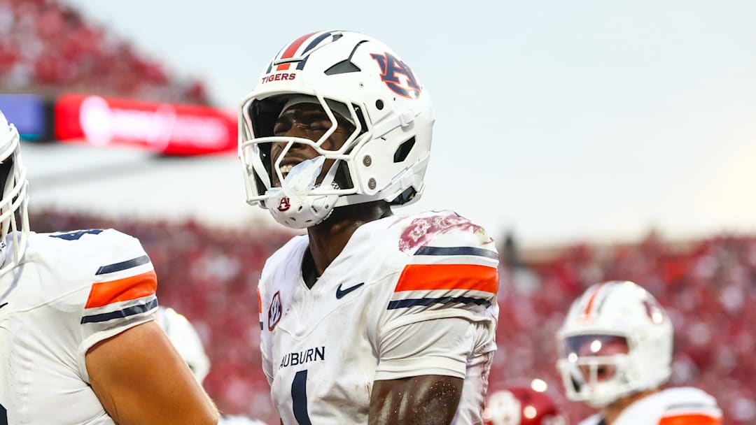 Auburn Tigers wide receiver Malcolm Simmons (4) celebrates with Auburn Tigers tight end Tate Johnson (42) after scoring a touchdown during the second half against the Oklahoma Sooners at Gaylord Family-Oklahoma Memorial Stadium.
