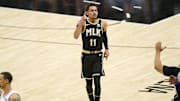 Jun 14, 2021; Atlanta, Georgia, USA; Atlanta Hawks guard Trae Young (11) celebrates after a three-pointer against the Philadelphia 76ers in the third quarter during game four in the second round of the 2021 NBA Playoffs at State Farm Arena. Mandatory Credit: Brett Davis-Imagn Images
