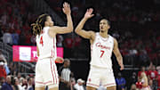 Dec 6, 2025; Houston, TX, USA; Houston Cougars guard Milos Uzan (7) celebraetes with guard Kingston Flemings (4) after a play during the second half against the Florida State Seminoles at Toyota Center. 