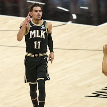 Jun 14, 2021; Atlanta, Georgia, USA; Atlanta Hawks guard Trae Young (11) celebrates after a three-pointer against the Philadelphia 76ers in the third quarter during game four in the second round of the 2021 NBA Playoffs at State Farm Arena. Mandatory Credit: Brett Davis-Imagn Images
